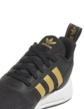 Zapatillas adidas multix j negro dorado de niño.