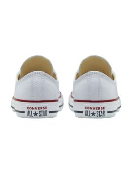 Zapatillas converse all star bajo piel blanco de mujer.