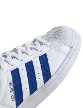 Zapatillas adidas superstar j blanco azul de niño.