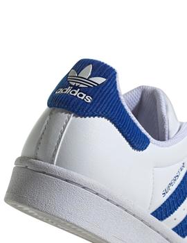 Zapatillas adidas superstar j blanco azul de niño.